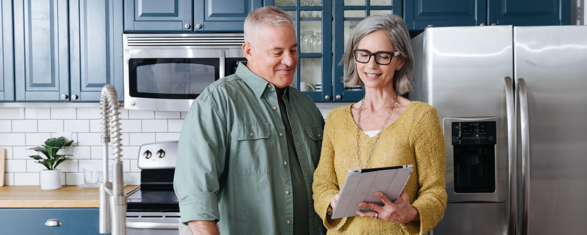 couple using a digital tablet