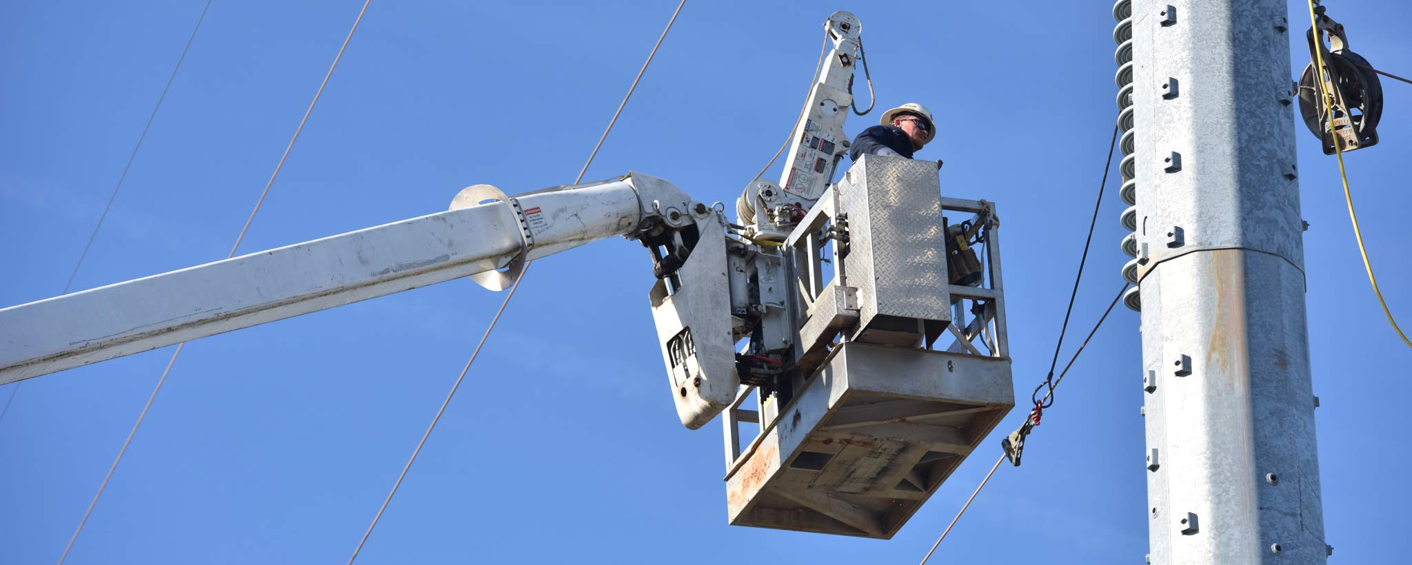 lineworker in a bucket truck lineworker in a bucket truck