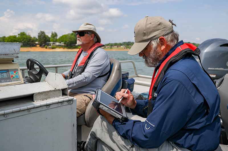 Pete Mangum and Kurt Lakin, TVA fisheries biologists, during the spring sport fish survey on Douglas Lake.