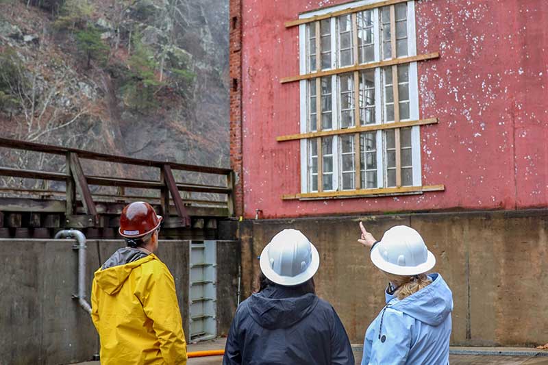 People outside historic building