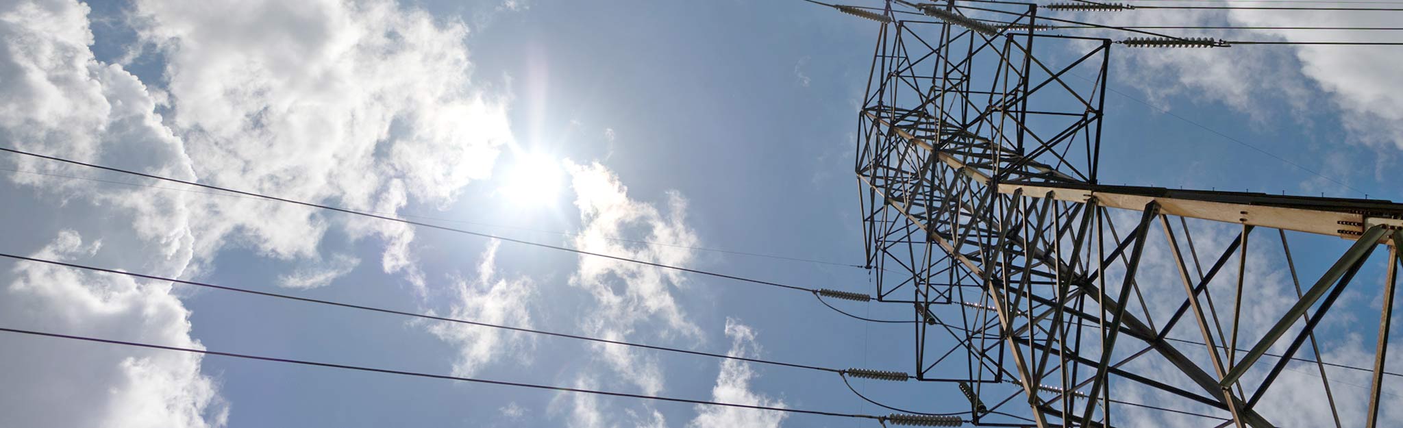 Transmission tower against a blue sky