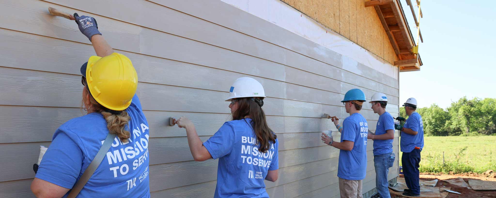 Volunteers painting home