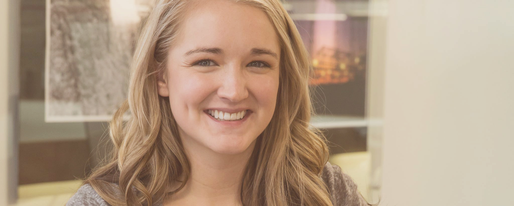 young_woman_smiling_hero young_woman_smiling_hero