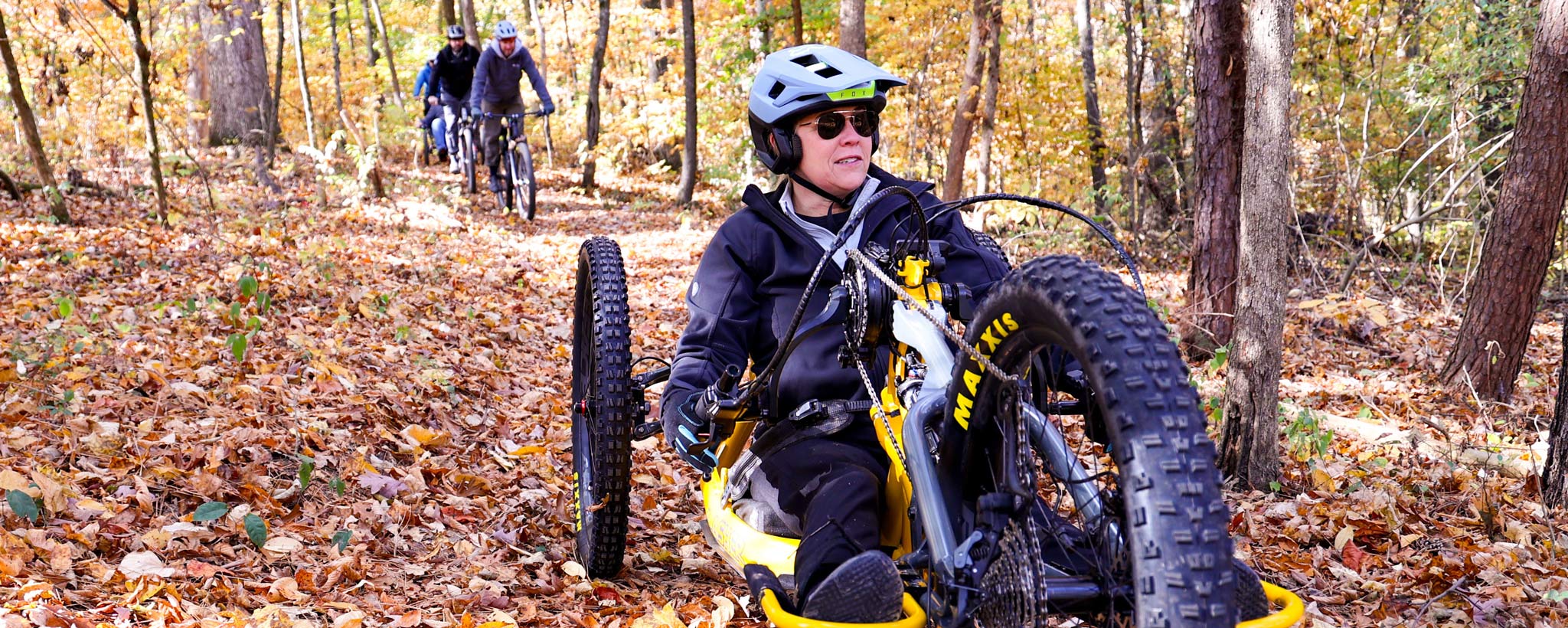Knox County ADA coordinator and Catalyst board member Carly Pearson rides an adaptive bike at Trotter Bluff Trail in east Tennessee