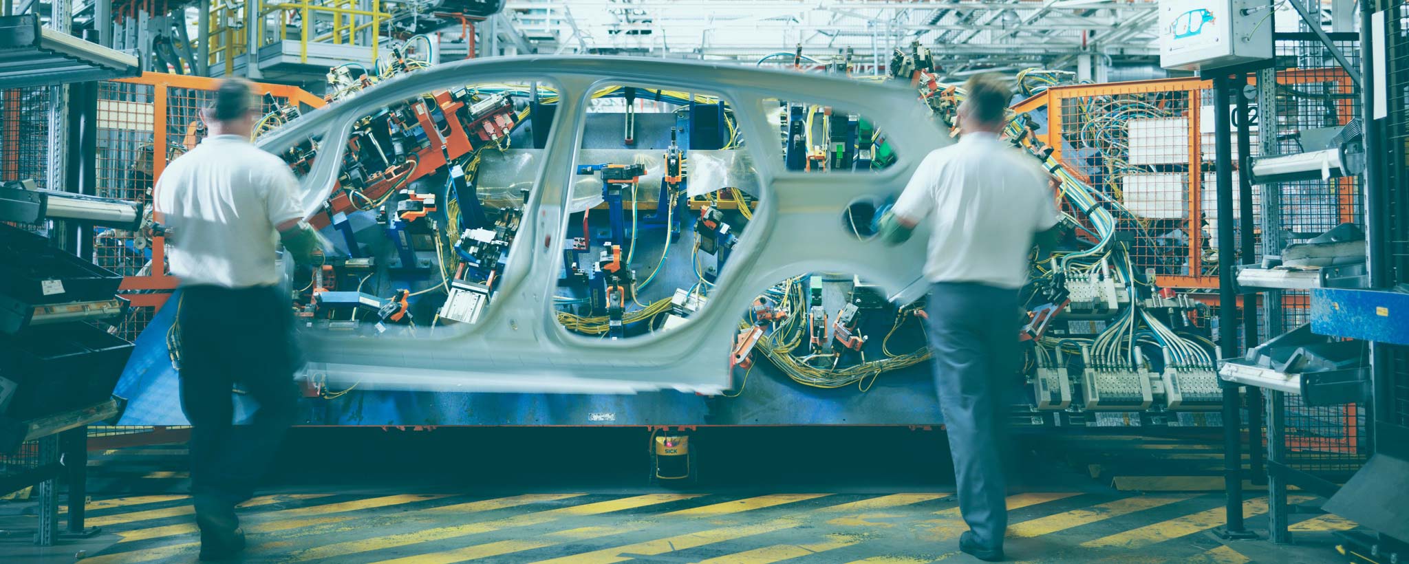 Engineers in a car factory