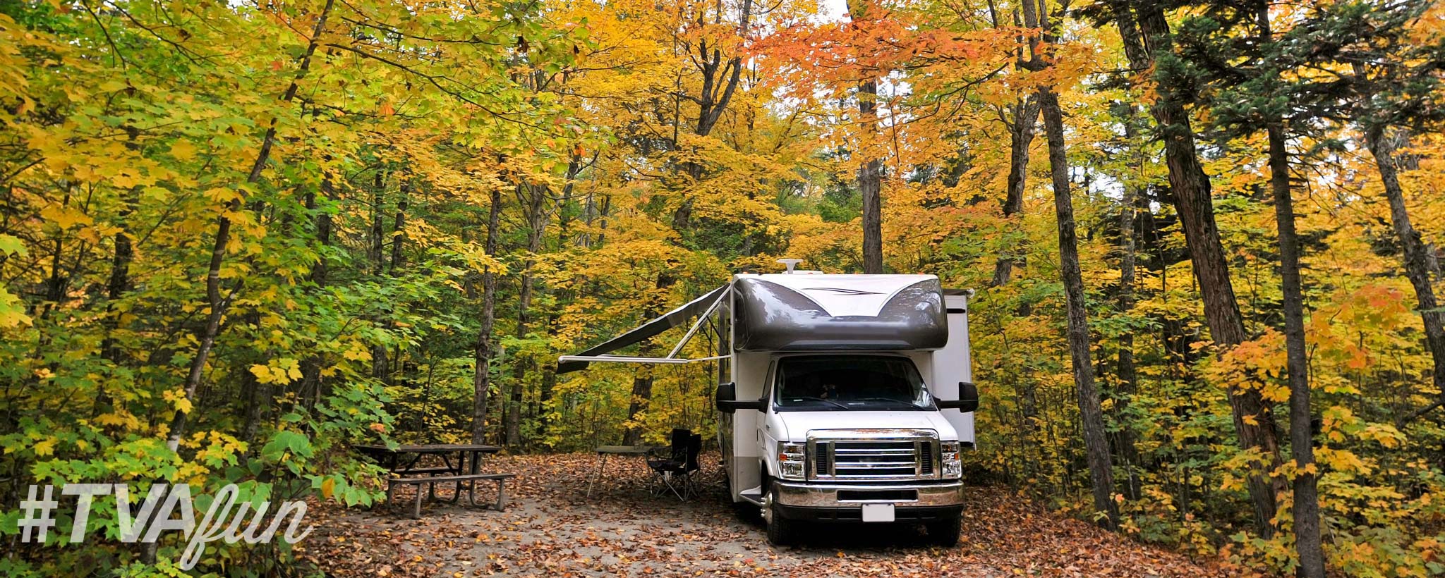 fallrvherogettyimages-8596308049c9f9e83-c21a-4489-a073-f7b7d9296b2c-2048-by-820.jpg RV in a camping ground