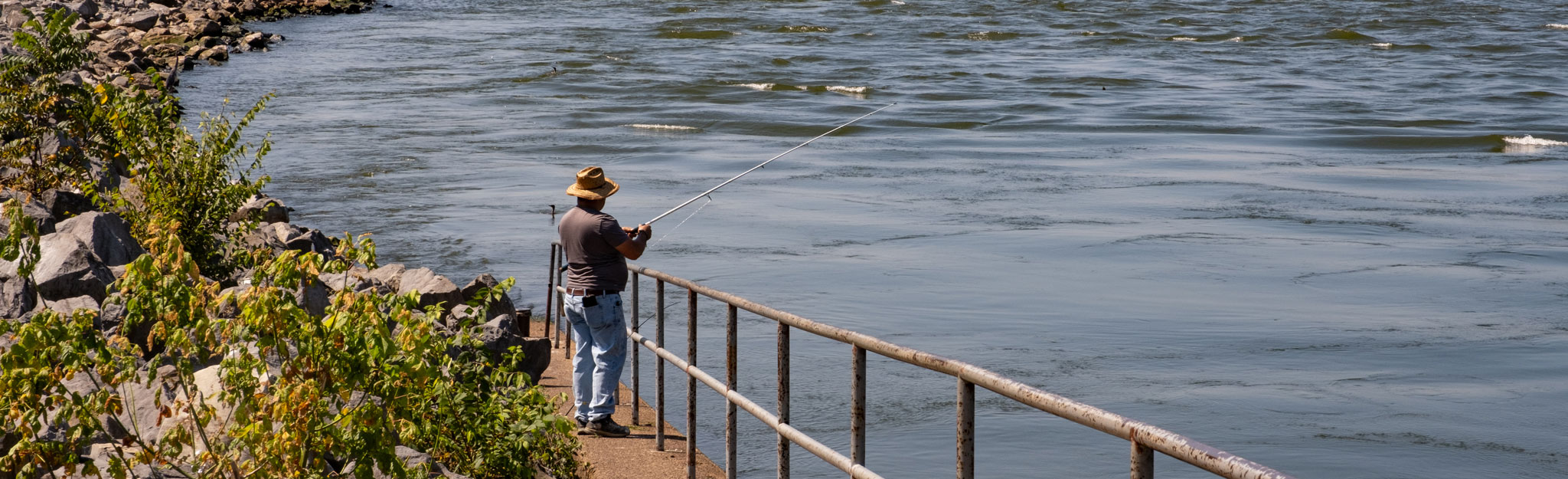 Man fishing by the river.