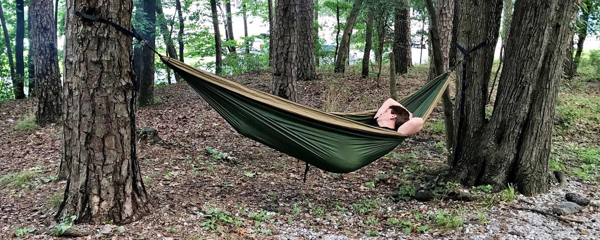 A Boy in laying in a  hammock