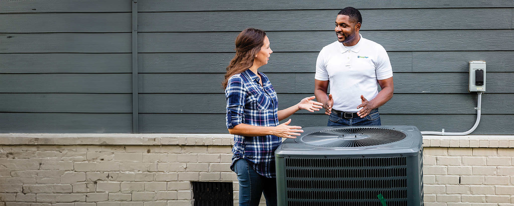 Heat pump discussion Man and woman having discussion by heat pump