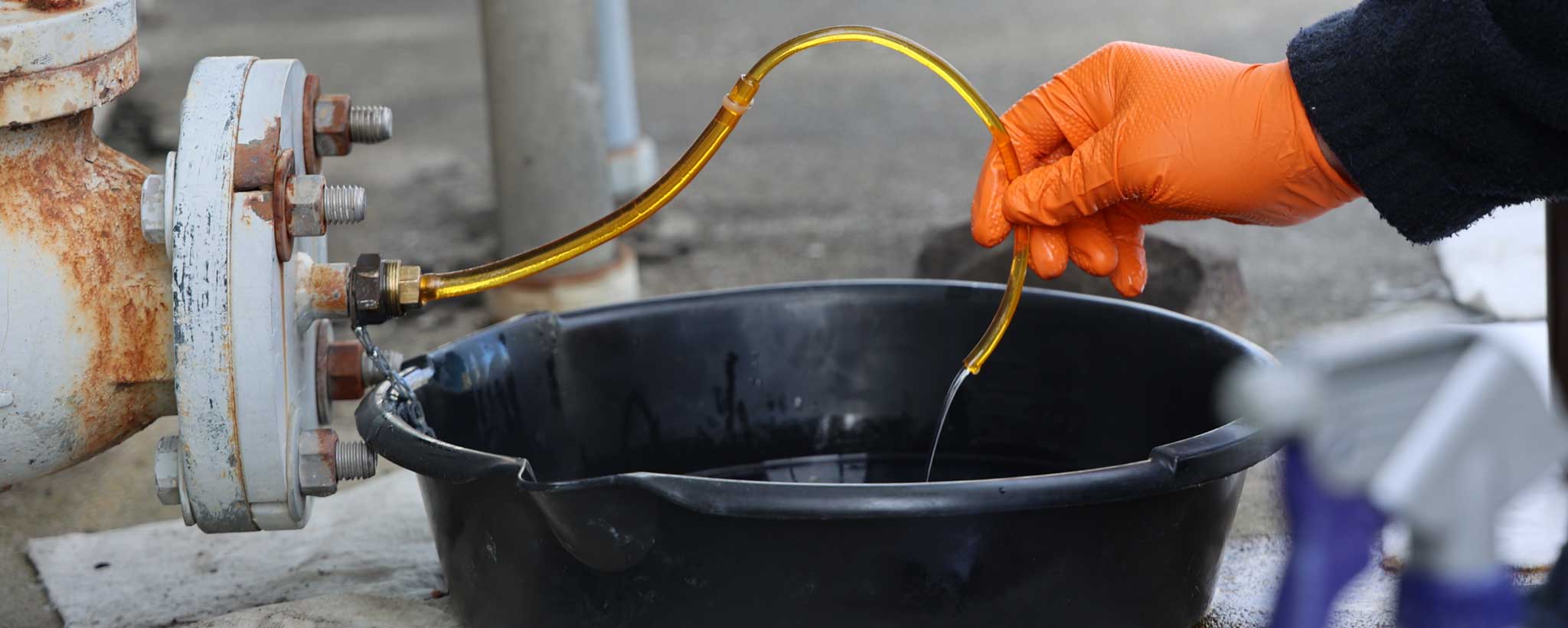 Checking oil Checking oil in an electrical transformer