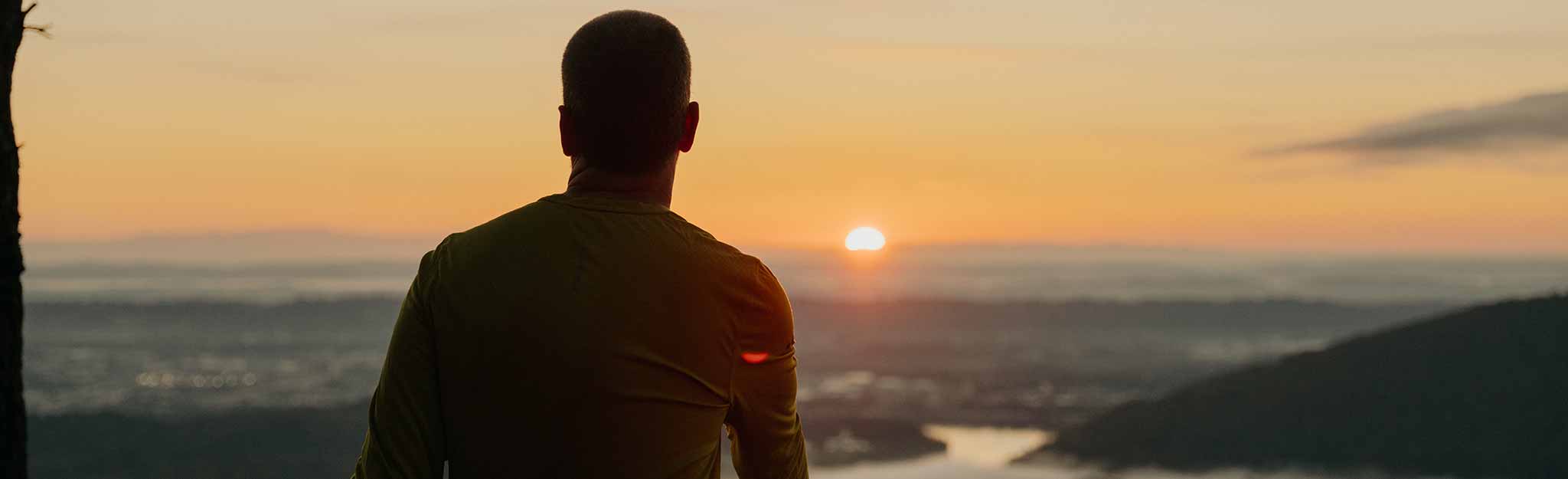 Silhouette overlooking Tennessee River at sunset