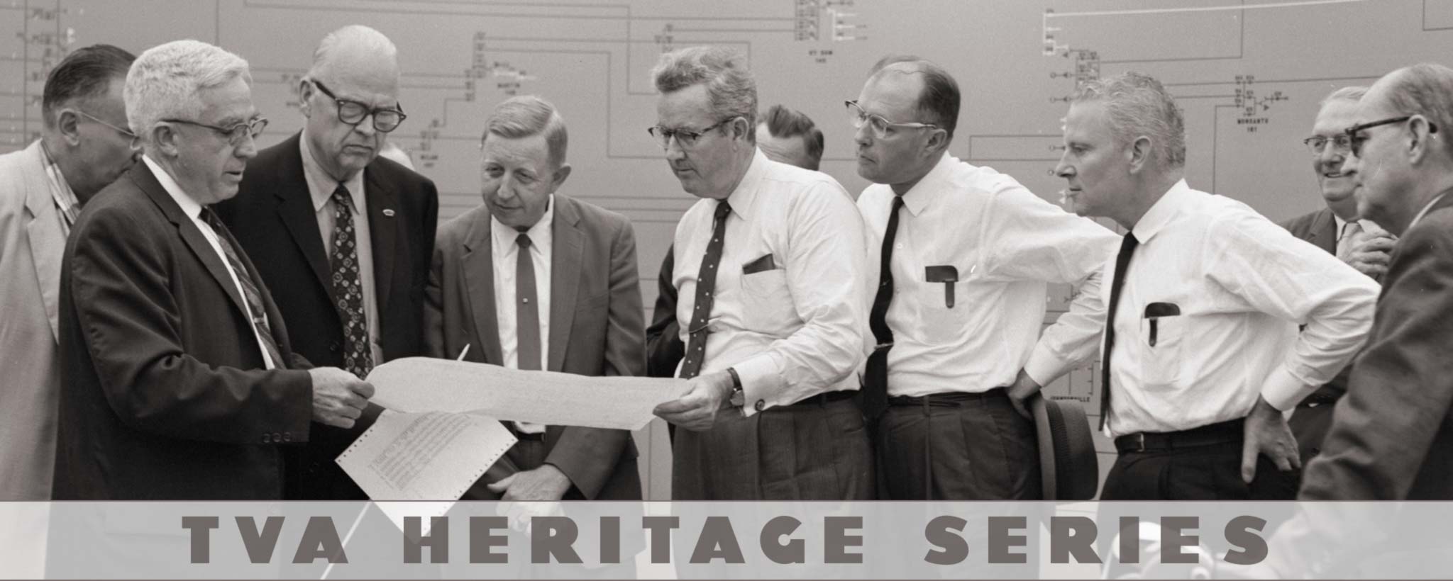 great-compromise-hero-KX-04093 men looking at papers