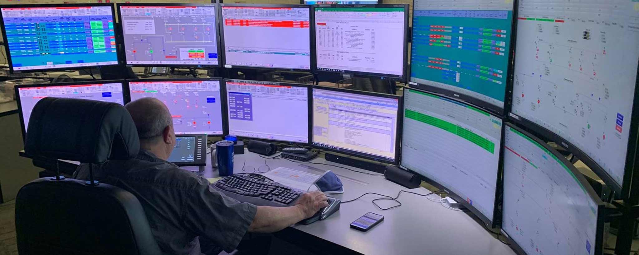 hydro-remote-control-system-reboot-hero-2048-by-820 Man working at the Hydro Dispatch Control Center