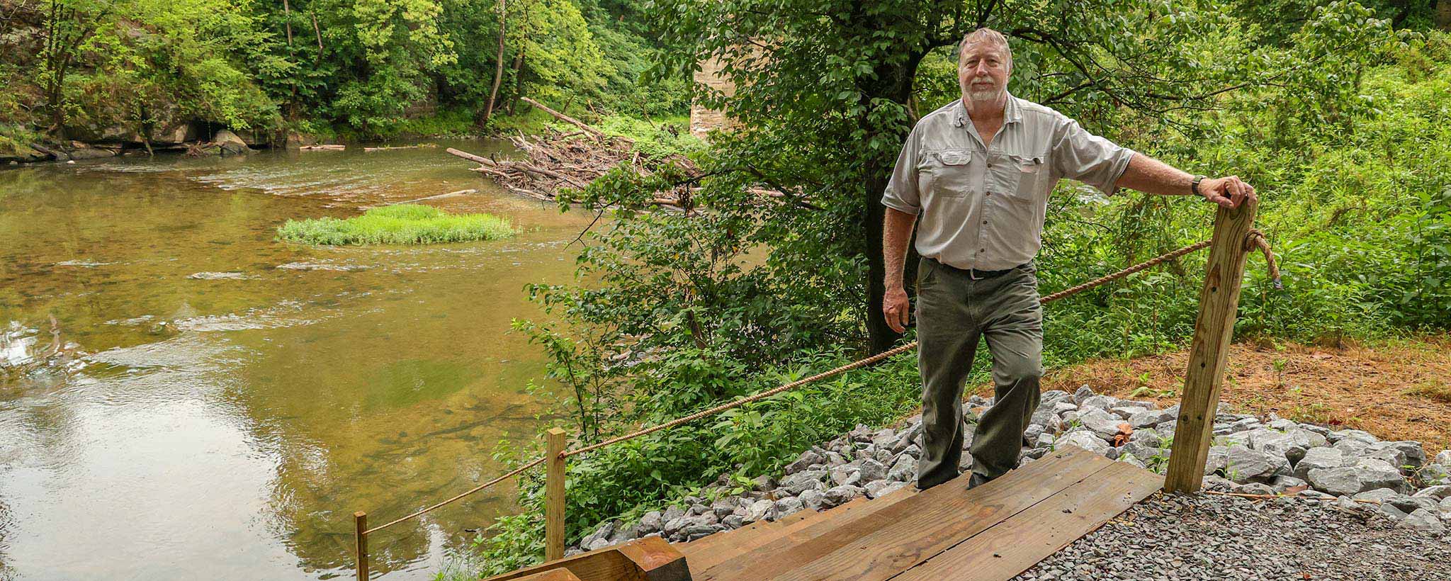Steps to river Jeff Womac standing on steps to river.
