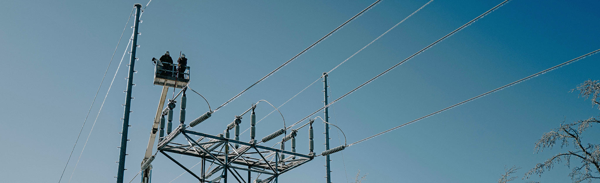 TVA line crew atop a transmission tower working to restore service following Winter Storm Fern
