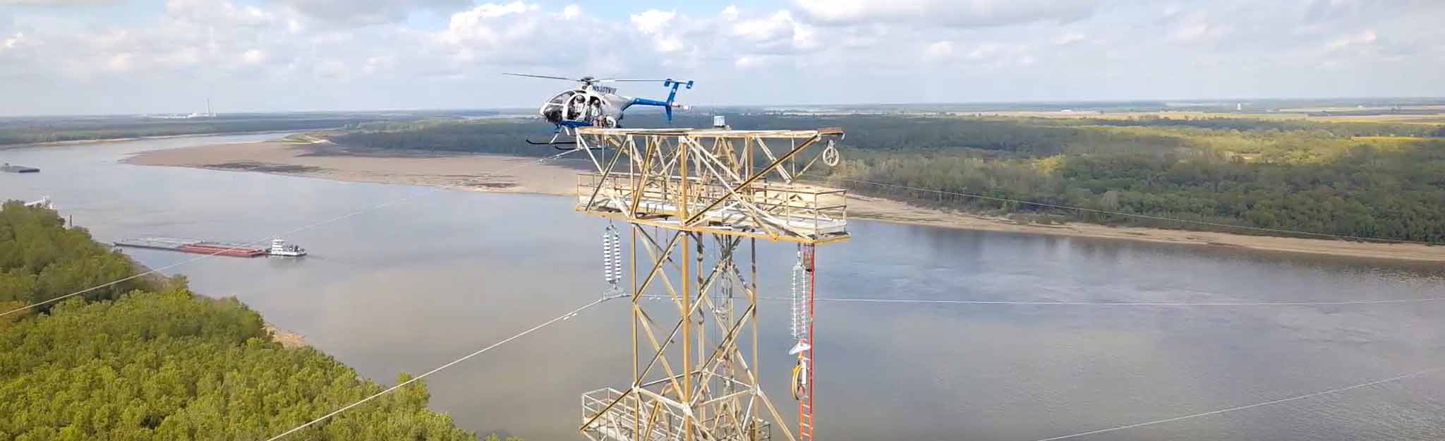 Aviation lineworkers help pull transmission line across Mississippi River