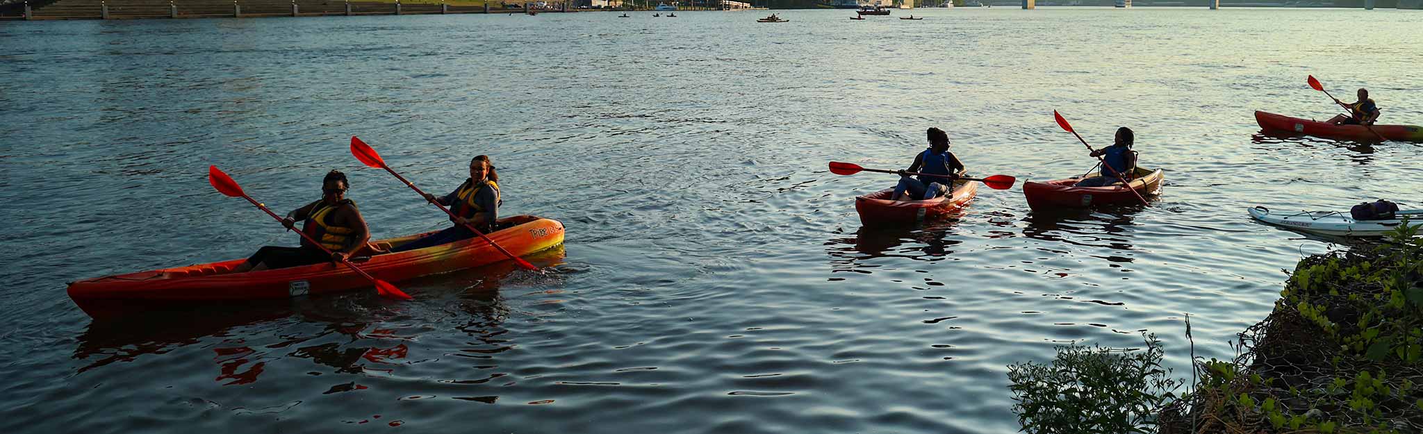 Kayakers on Tennessee River at sunset