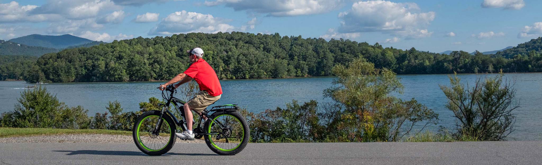 A man cycling on top of Chatuge Dam
