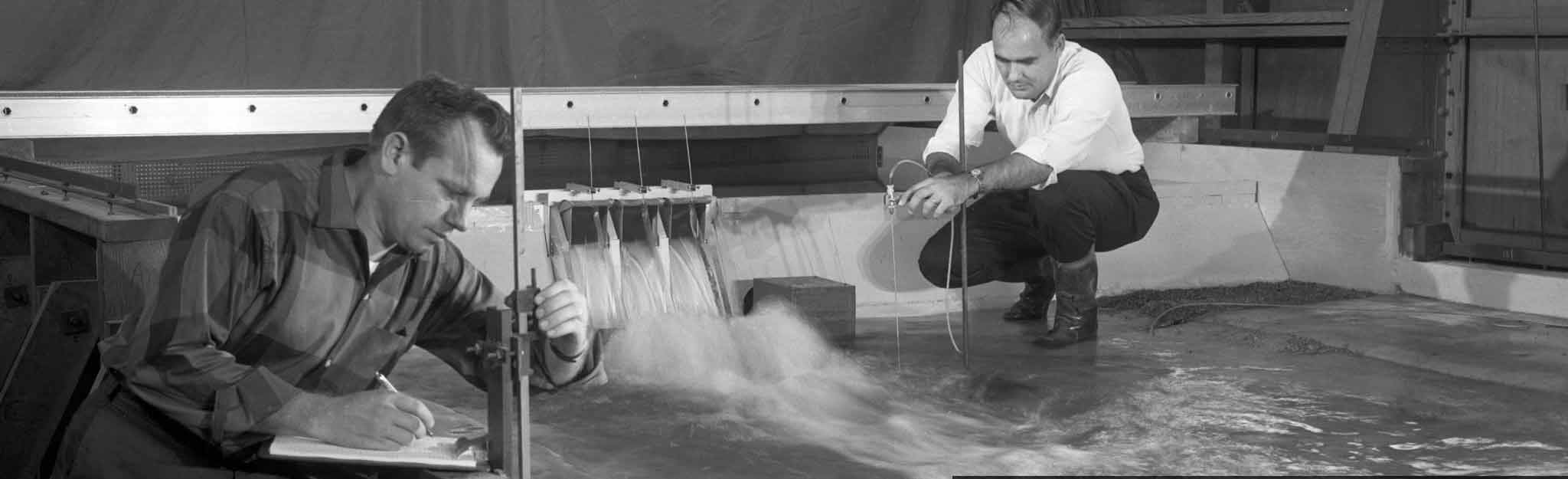 Engineers with model of Tims Ford Dam