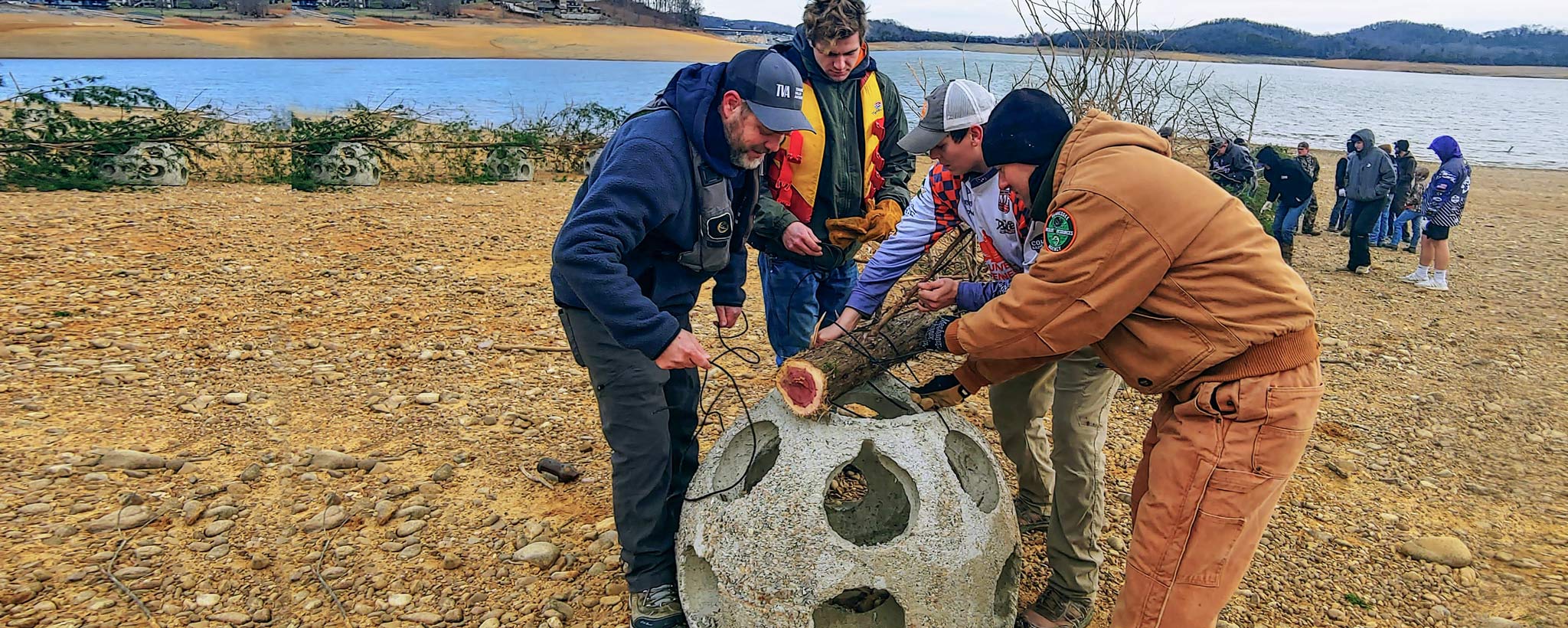 Something fishy reef ball hero Adding recycled Christmas tree to reef ball