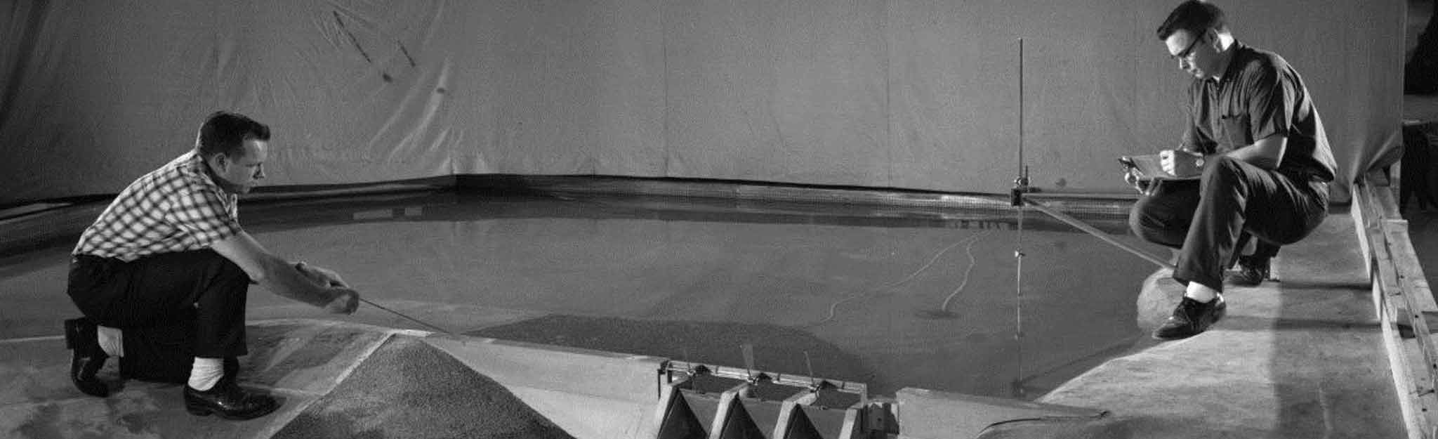 Engineers with model of Tellico Dam