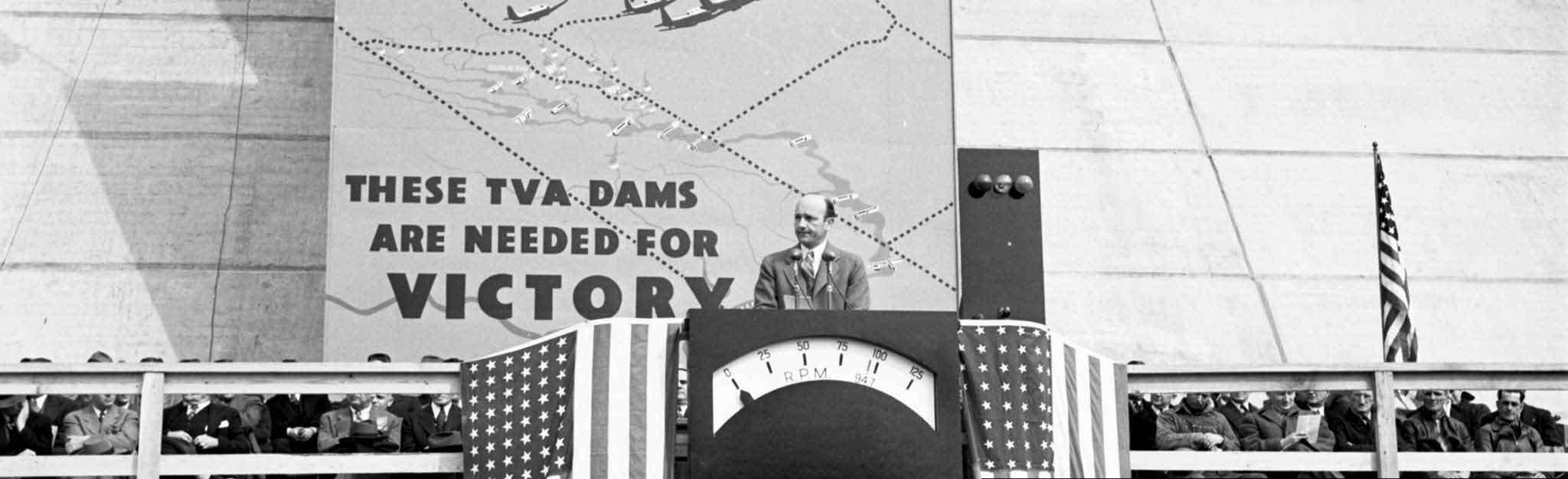 Sign at TVA dam dedication: TVA dams are needed for Victory"
