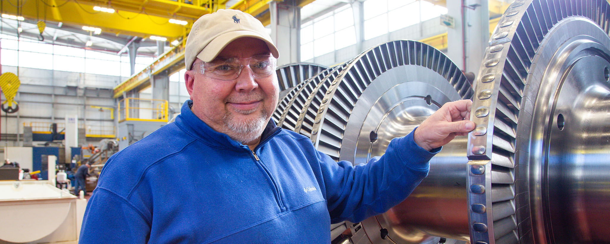Wayne Davis Wayne Davis standing in front of equipment.