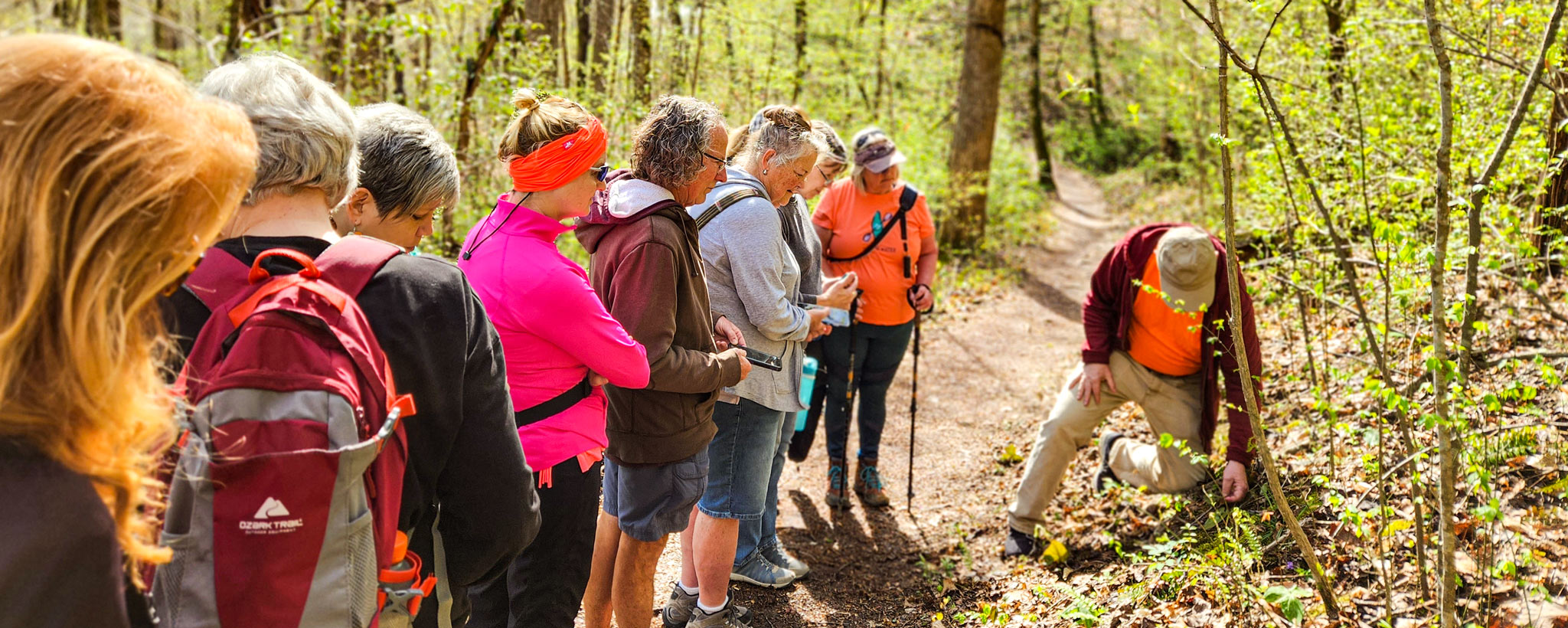 Participants on River Bluff Trail exploring native wildflowers Participants on River Bluff Trail exploring native wildflowers