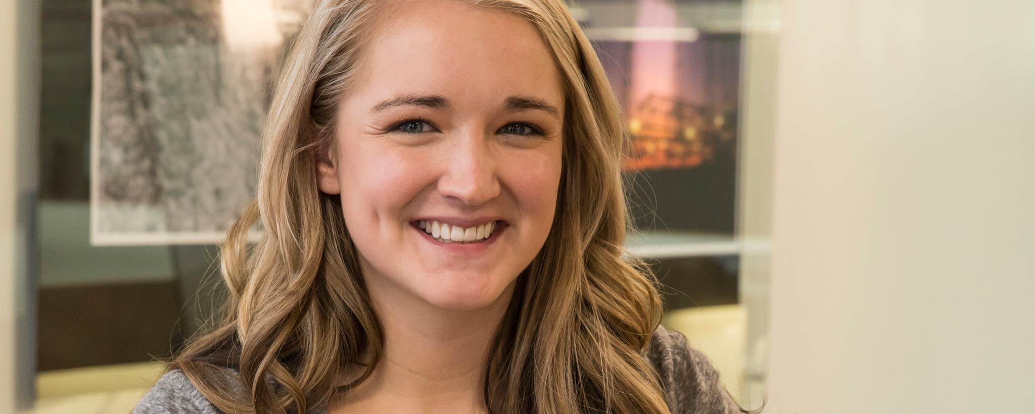 young_woman_smiling_hero young_woman_smiling_hero