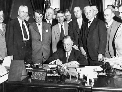 President Franklin Delano Roosevelt signs the TVA Act in May 1933.