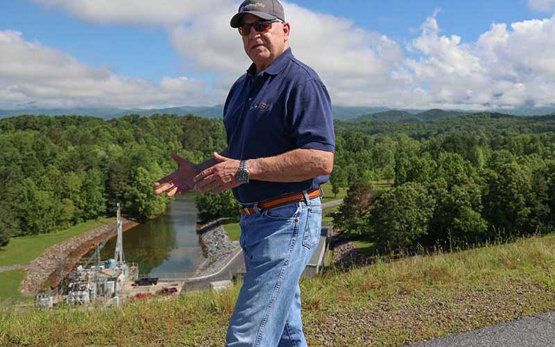 Dam safety engineer Bernie Auld walking at a TVA dam