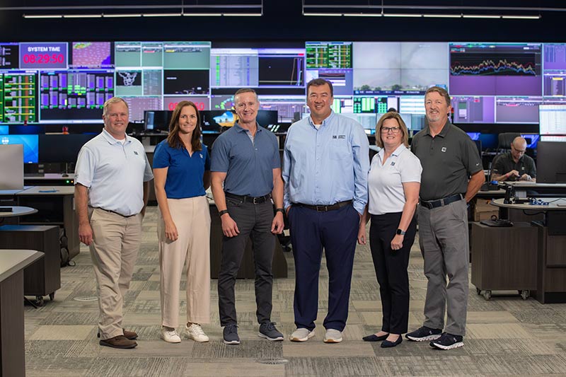 Group photo of TVA leadership at new facility