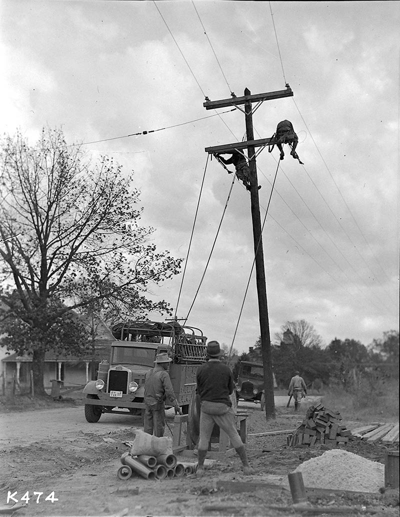 TVA lineworkers string electrical lines in rural Alabama in 1935.