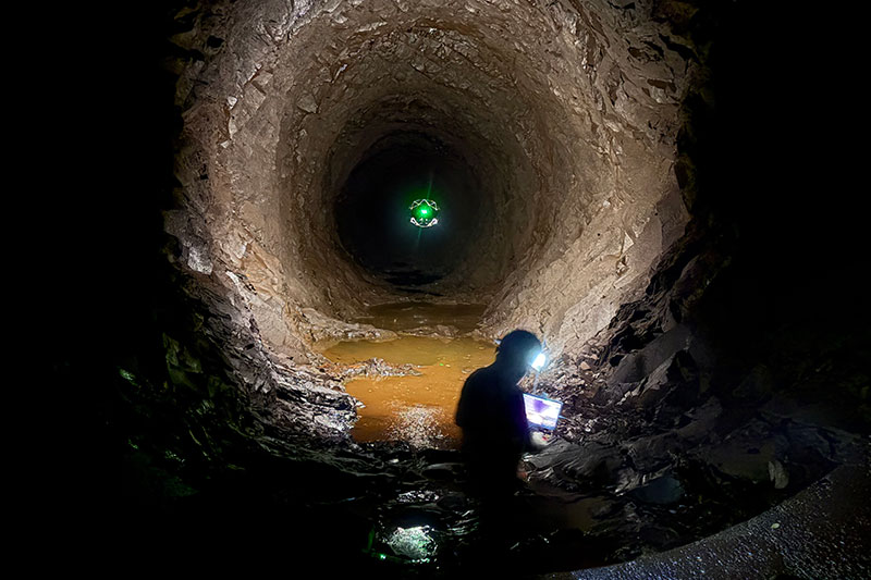 A drone flies through the penstock.