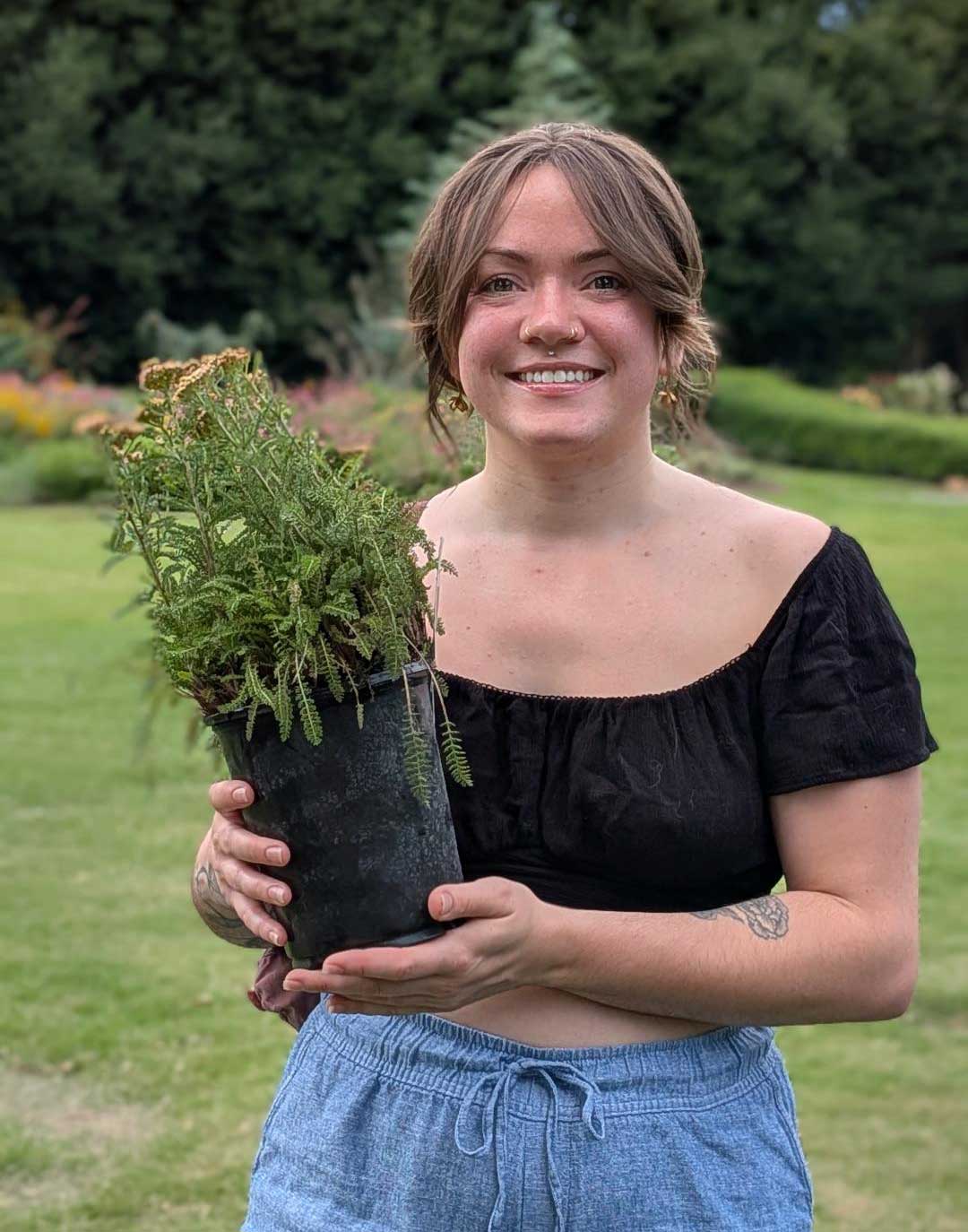 Woman with native plant