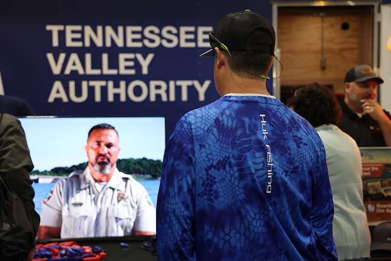 People watching a video about the dangers of boating near dams