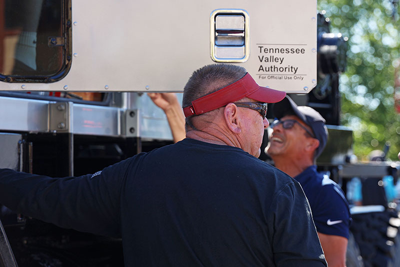 TVA employees give students an opportunity to sit behind the wheel of a large truck.