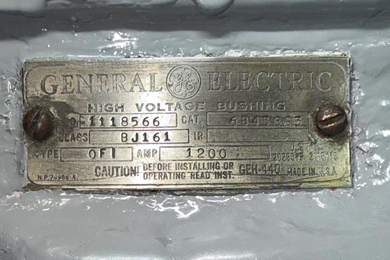 The General Electric emblem on the 1920s bushing