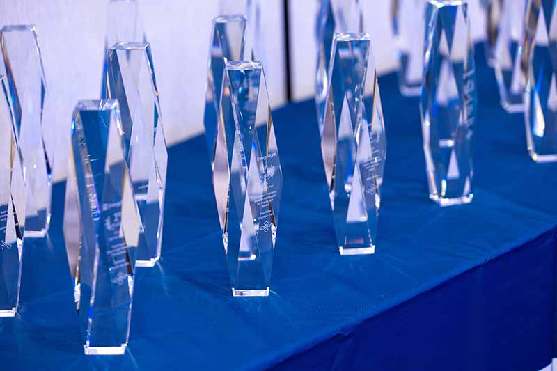 Close up of awards on table