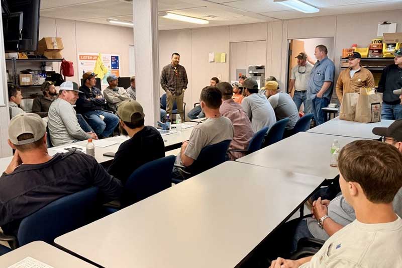 Lineworkers in a meeting