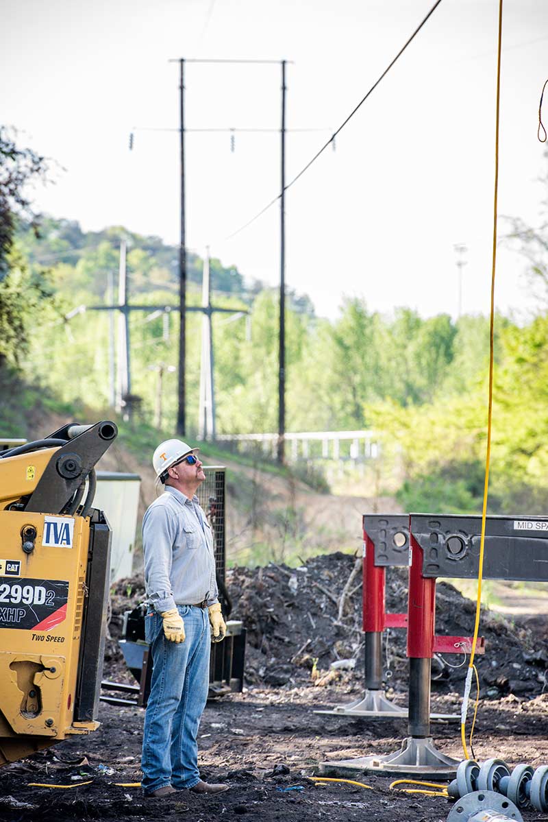 Simmons monitors work along a transmission right of way.