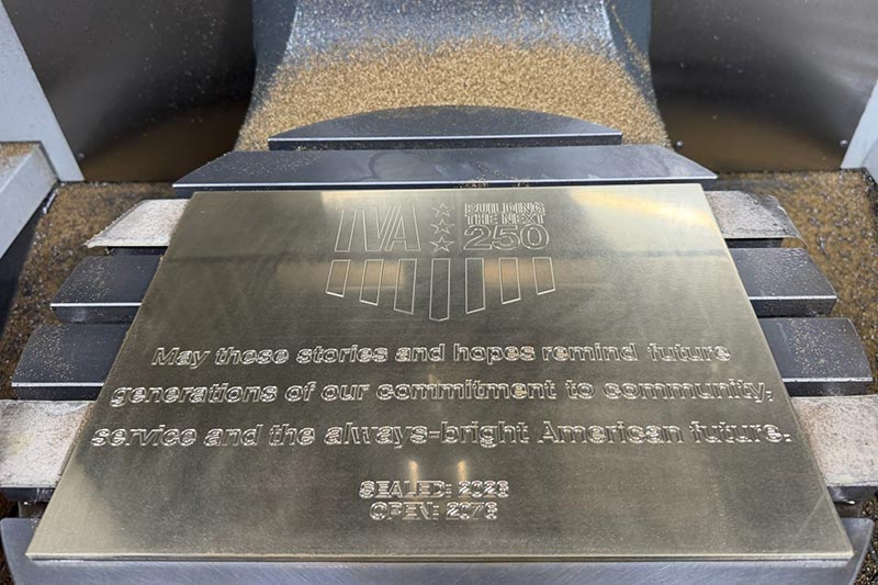 The finished nameplate that will be affixed to the time capsule