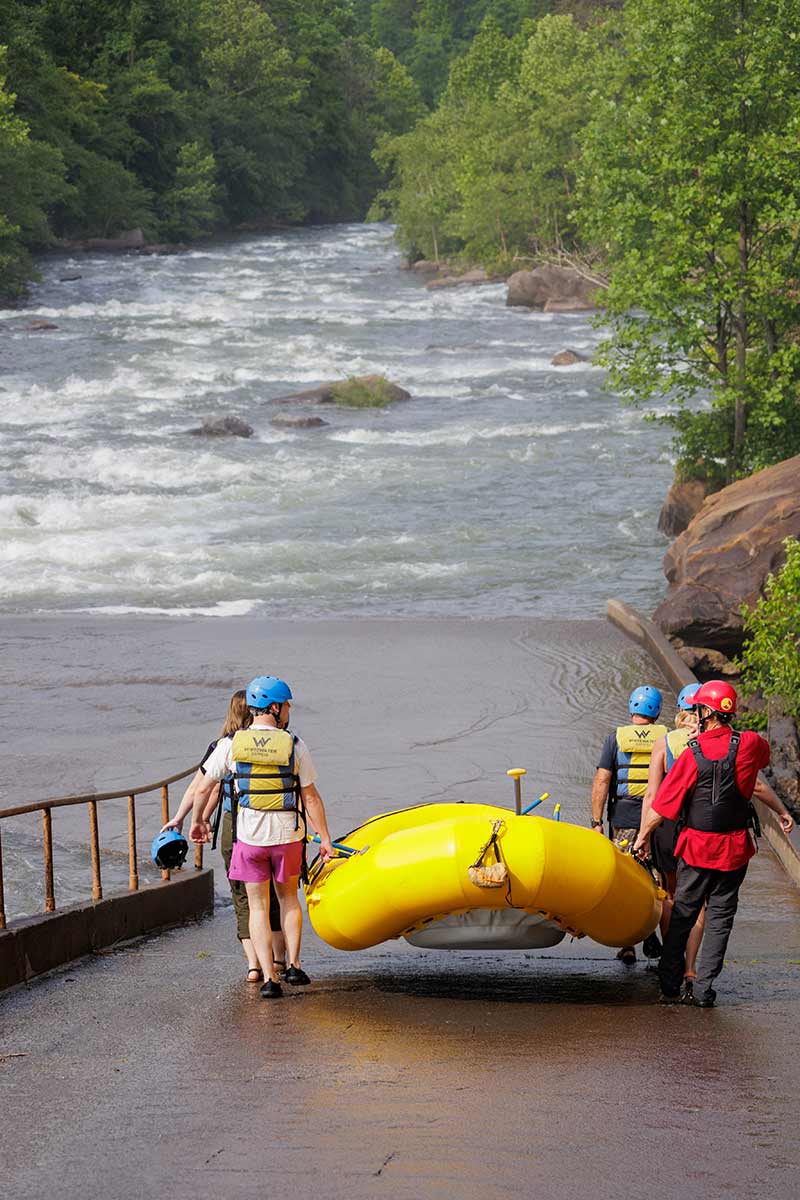 Rafters carry raft to the put-in