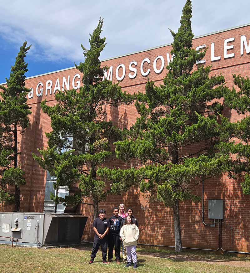 Students in front of school