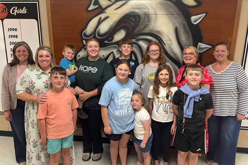 Students in front of bulldog mural