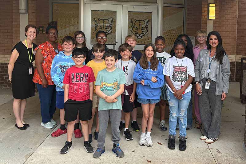 Students in front of school