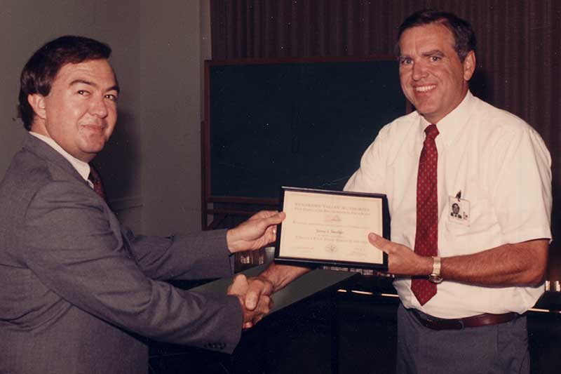 Jim Standifer receiving his 25-years-of-service award from TVA
