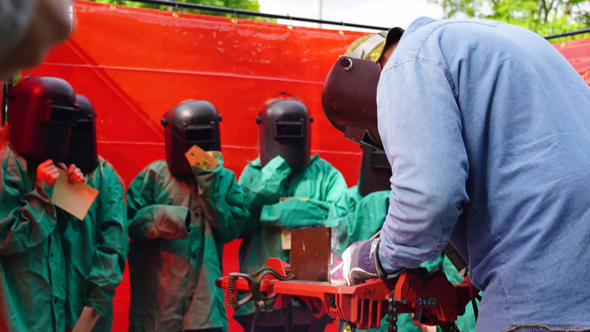 Students watch a welding demonstration at TVA Day at Boone Dam