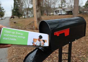 A DIY Home Energy Assessment kit placed in a mailbox