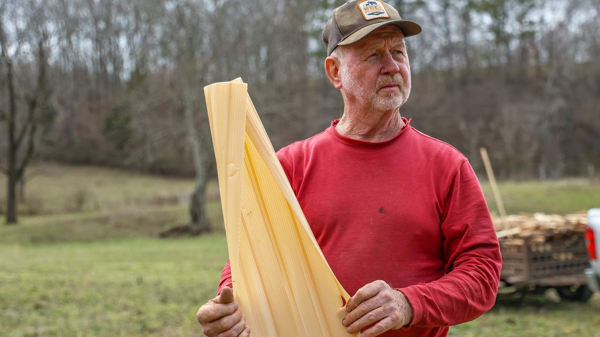 Farmer holding tree wrap